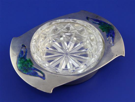 An Edwardian Arts & Crafts Liberty & Co Cymric silver and enamel butter dish, 5.5in.